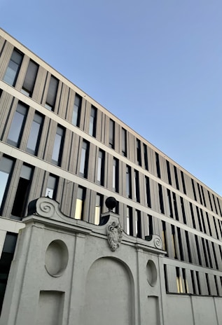Wide shot of a modern building facade featuring elegant and sturdy decorative elements.
