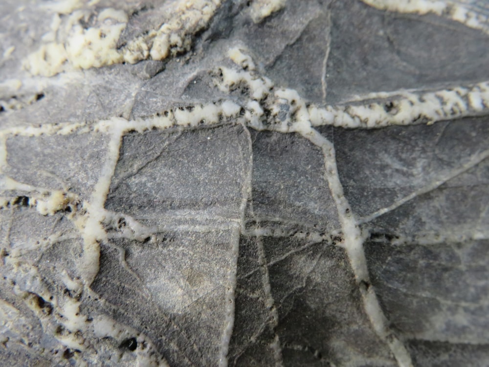 a close up of a rock with a cross on it