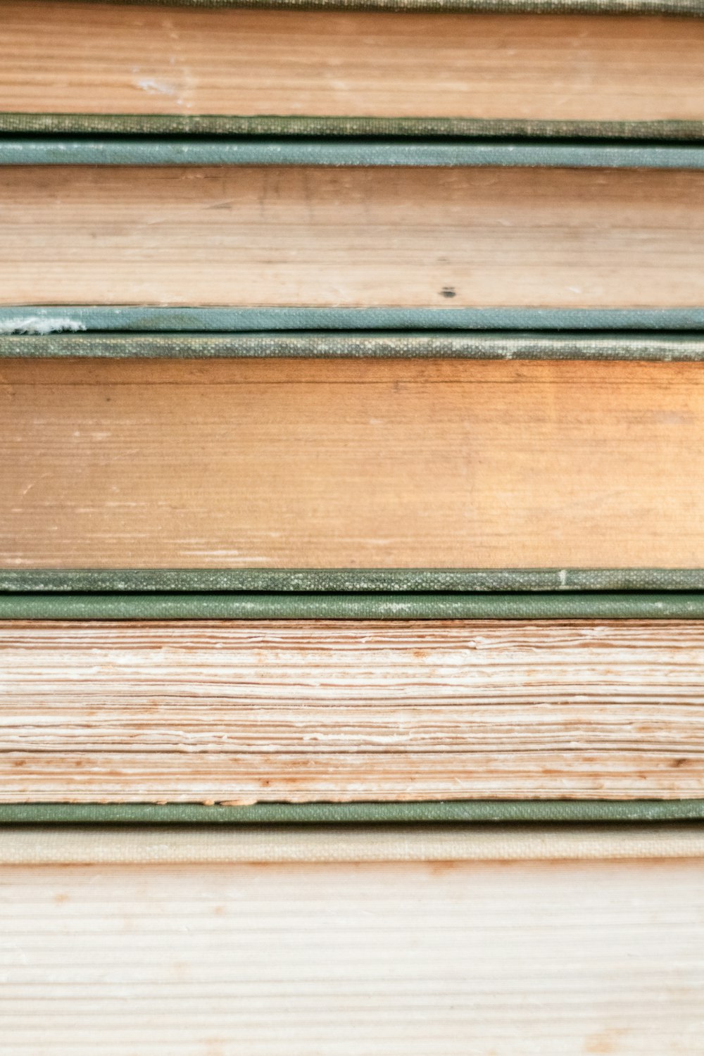a close up of a stack of wooden boards