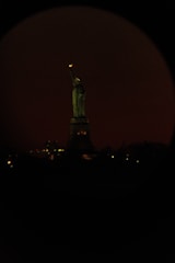 An inviting image of the Statue of Liberty bathed in soft earthy light.