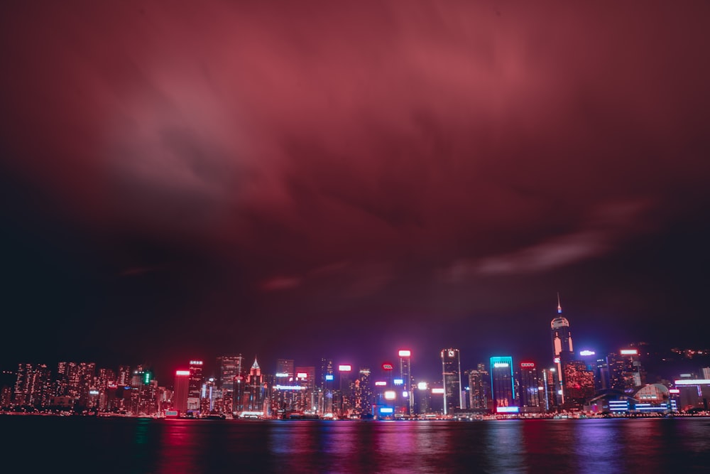 a view of a city at night from the water