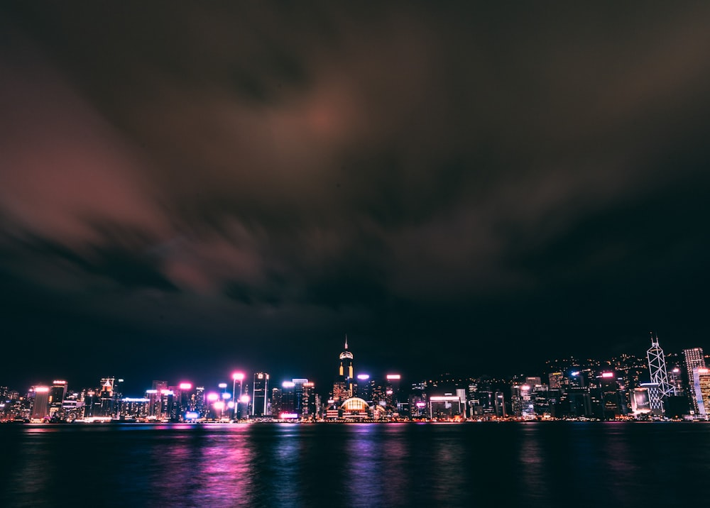 a view of a city at night from the water