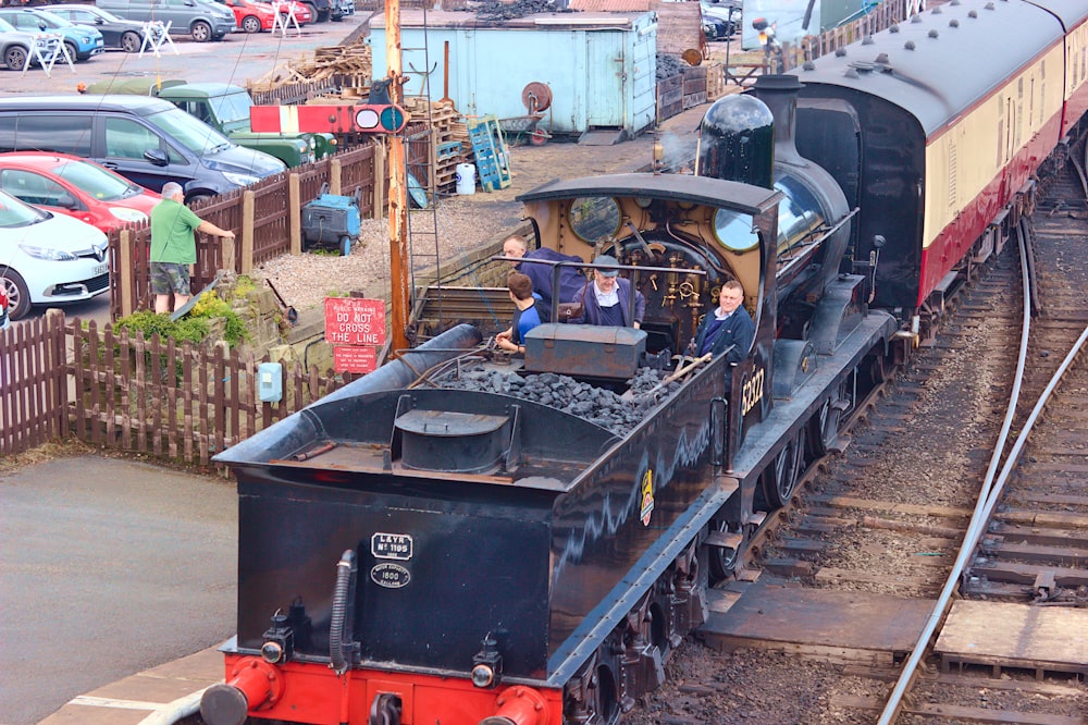 a train engine carrying carts down a track