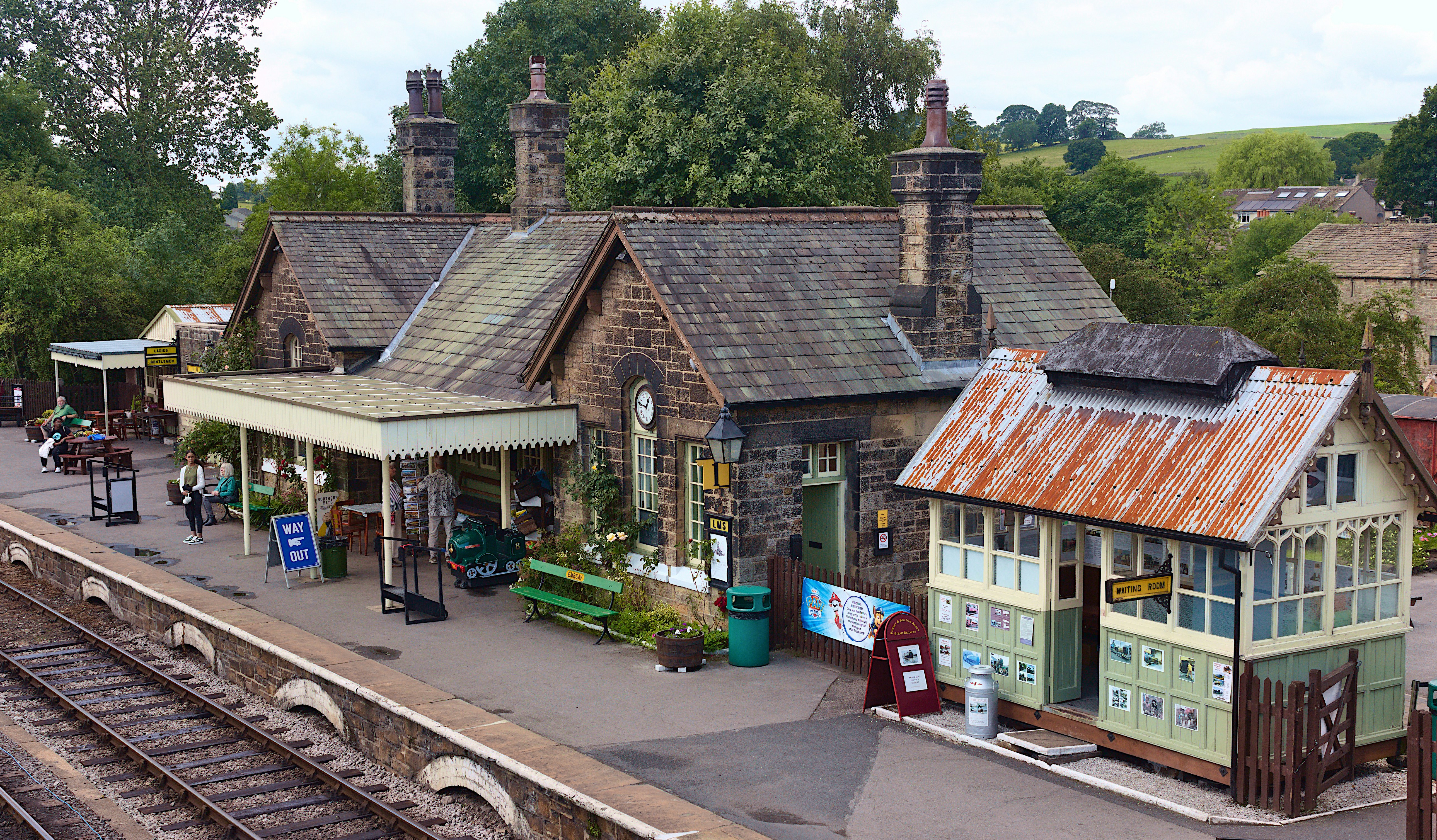 a train station with a train on the tracks
