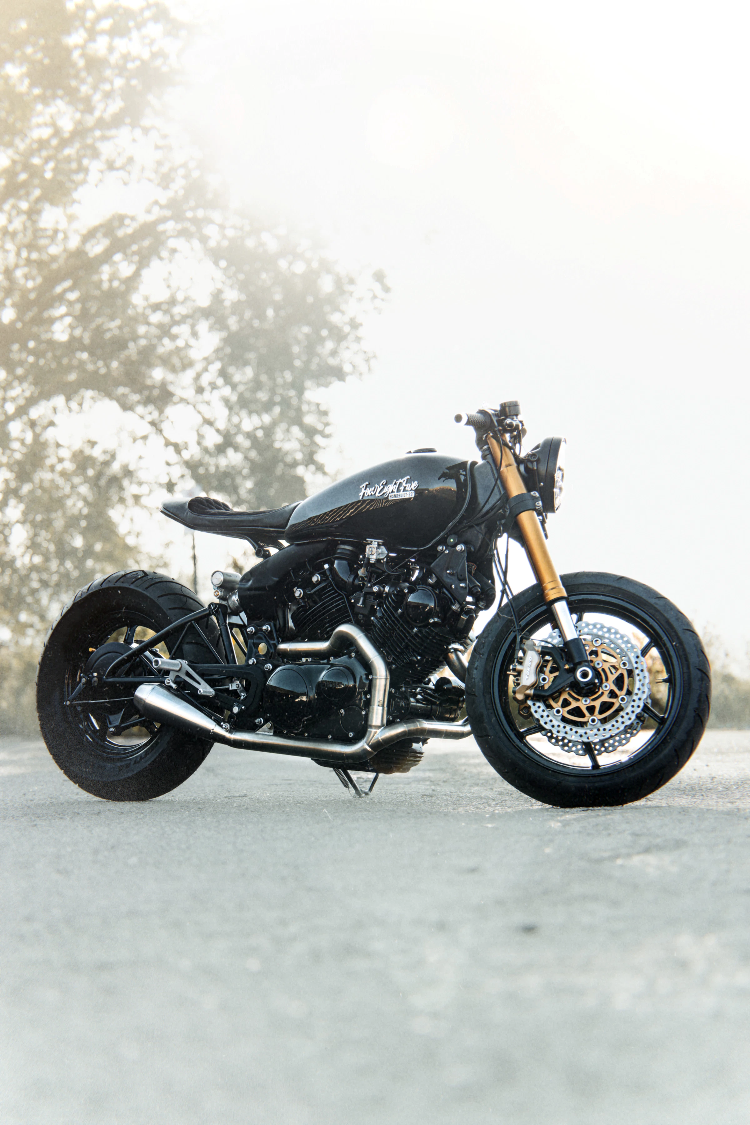 Illustrative photo of a custom motorcycle parked by the road