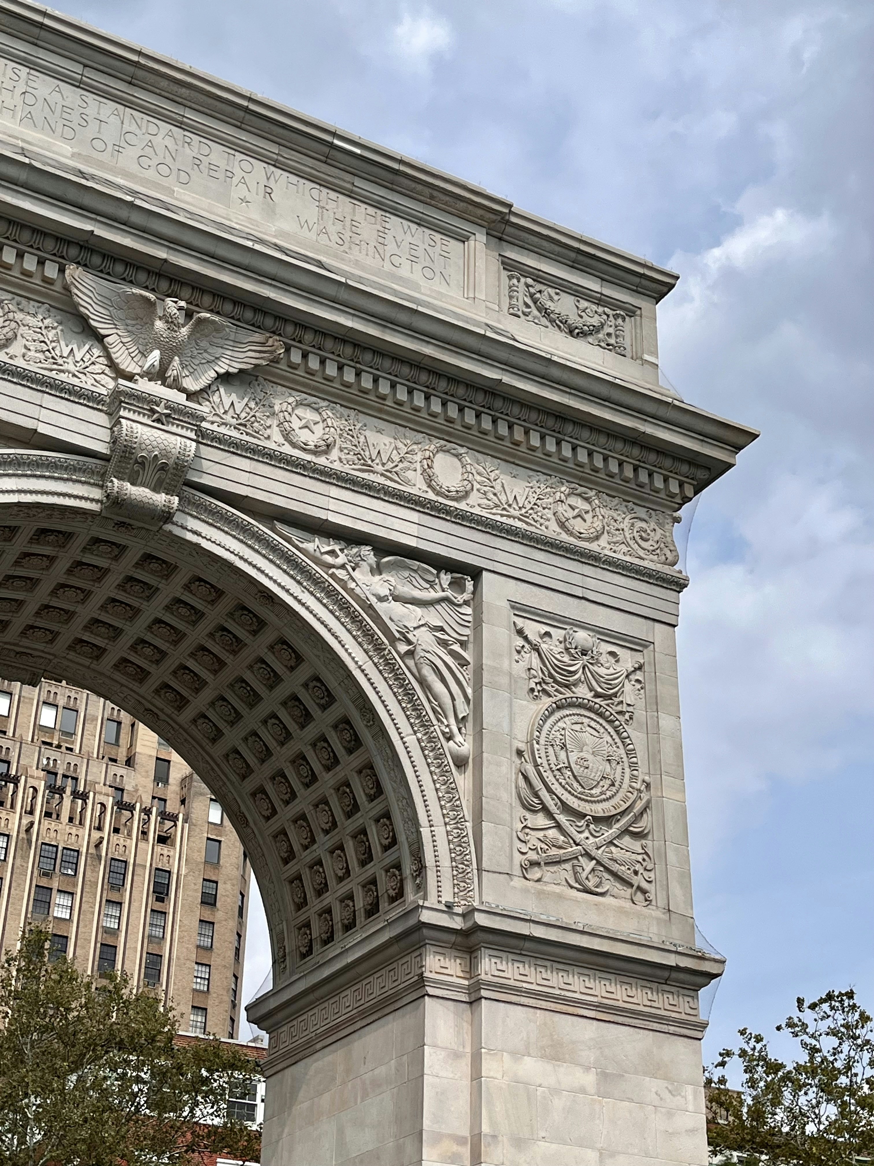 A large stone arch with a clock on it