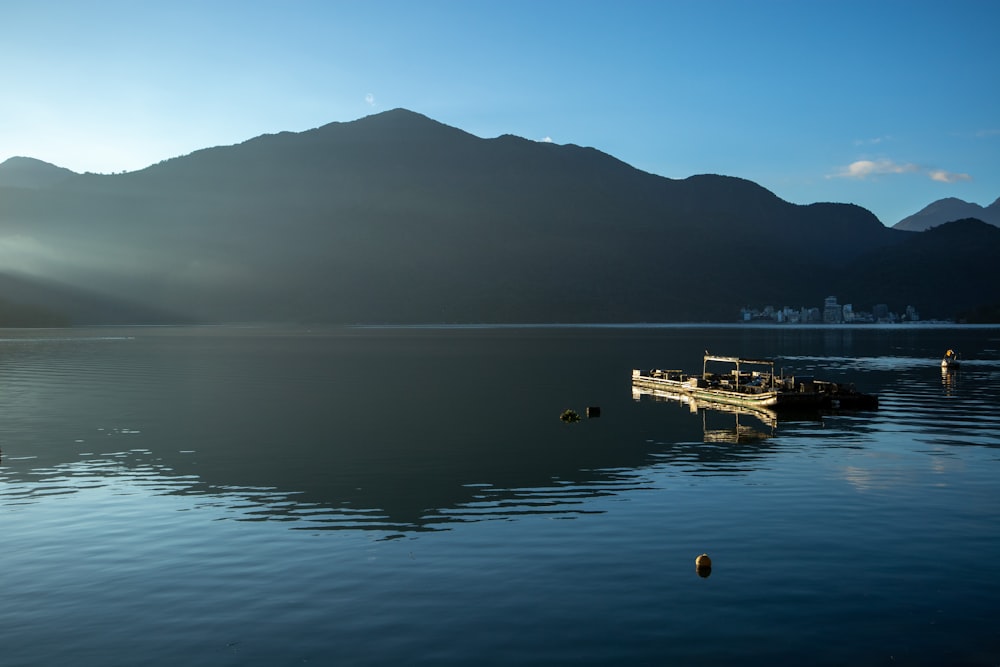 a boat floating on top of a large body of water