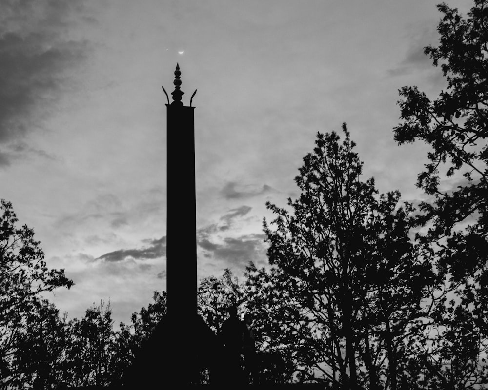 a black and white photo of a clock tower