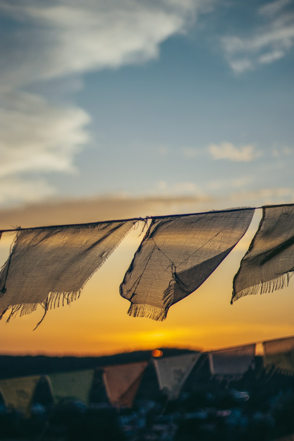 a group of cloths hanging from a clothes line