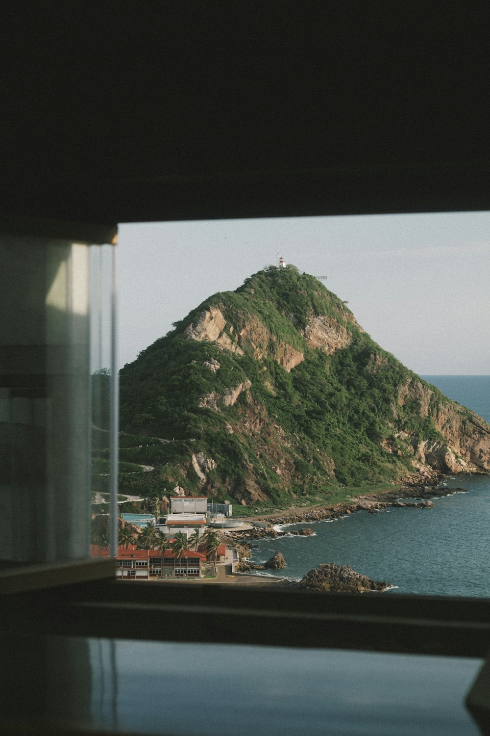 a view of a mountain and a body of water