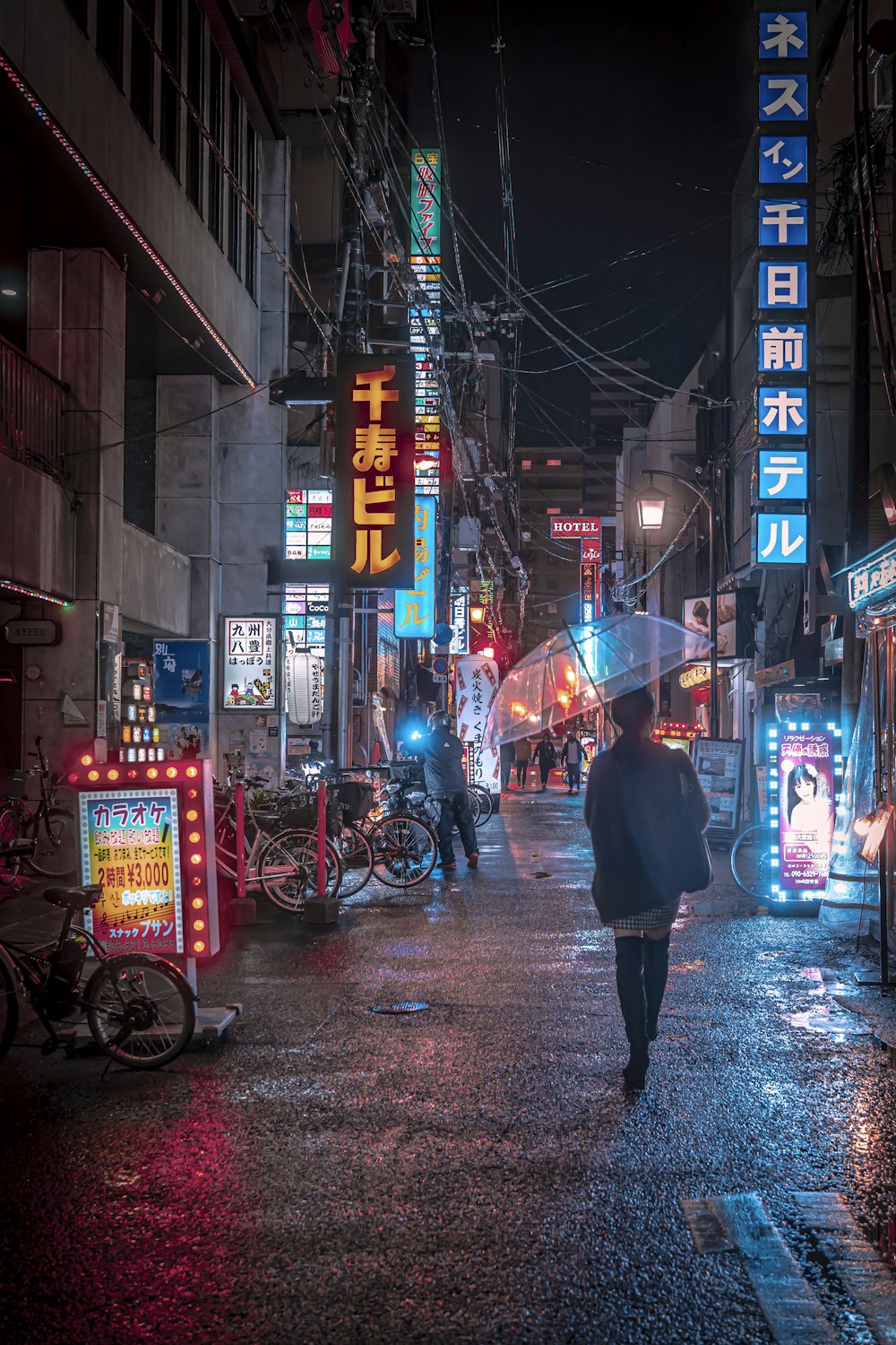 a man walking down a street holding an umbrella