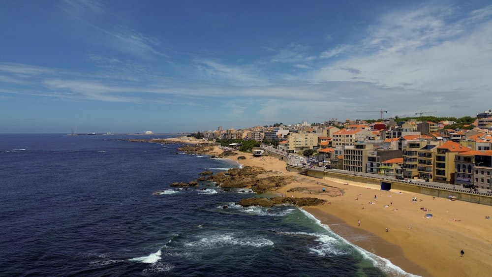 a view of a beach with a city in the background