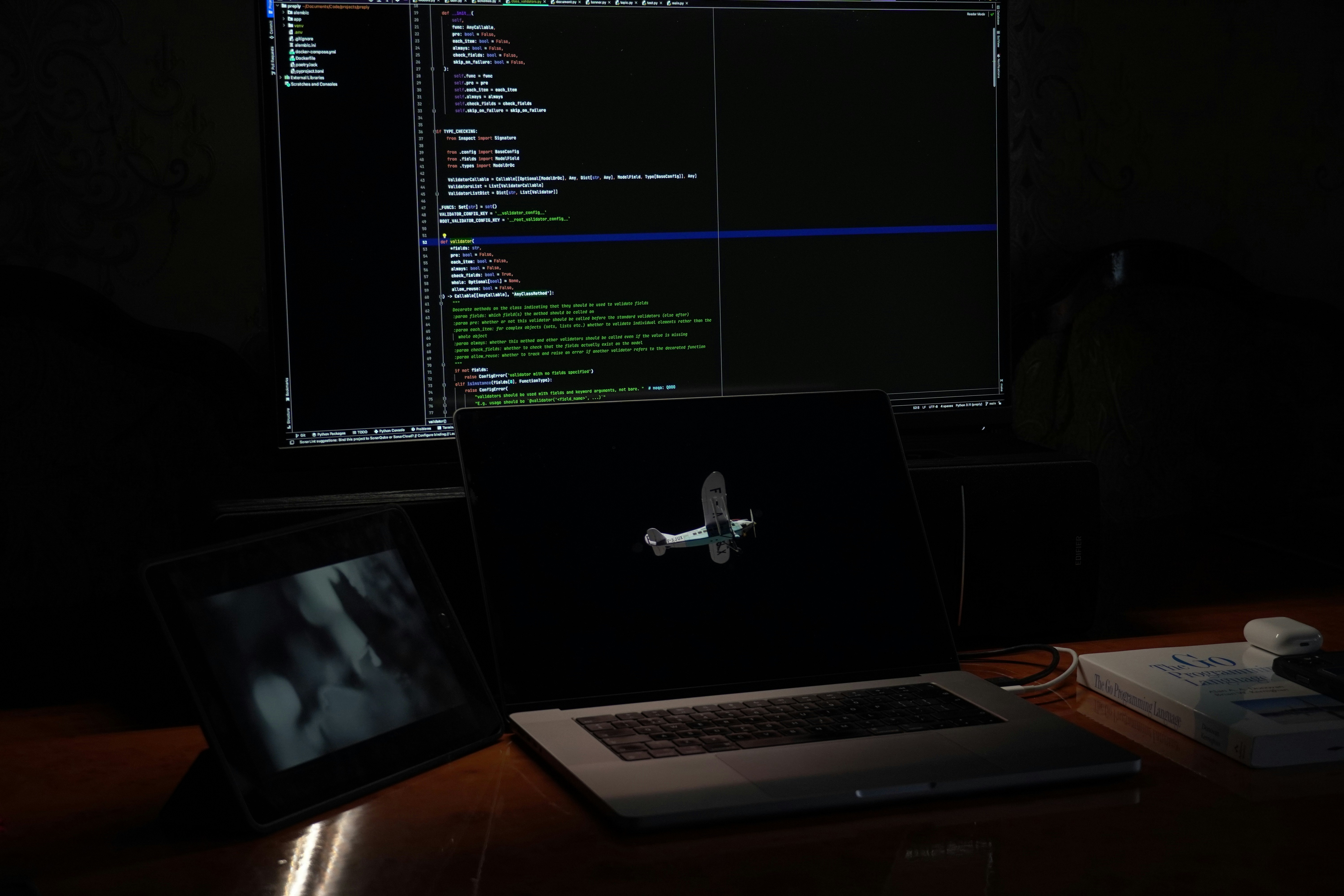 Programmer using an advanced IDE with code suggestions and AI assistant chat displayed on screen, dark theme, focused atmosphere, modern office setting.