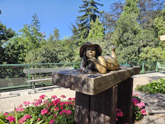 A relaxed pose of a woman outdoors, embodying the spirit of the bronze category.