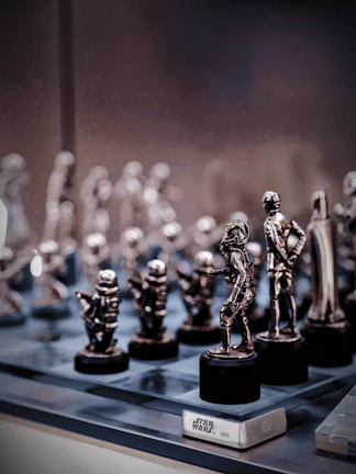 Close-up of collectible figurines of famous video game characters with a galaxy backdrop.