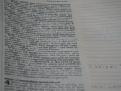Close-up of scripture notes and highlighted Bible verses, illustrating deep study and application.