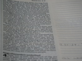 Close-up of scripture notes and highlighted Bible verses, illustrating deep study and application.