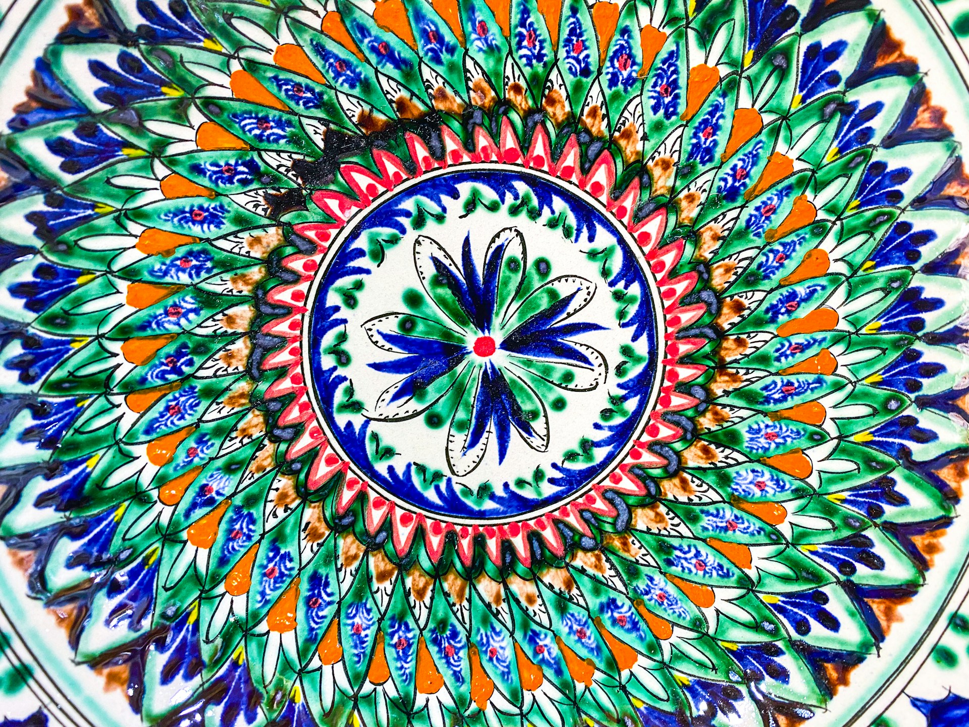 A vibrant hand-painted Madhubani artwork showcasing intricate patterns and traditional motifs.