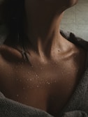 a close up of a person with a towel on