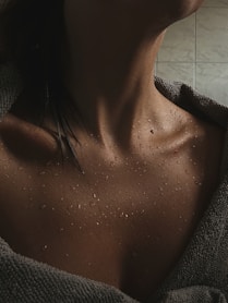 a close up of a person with a towel on