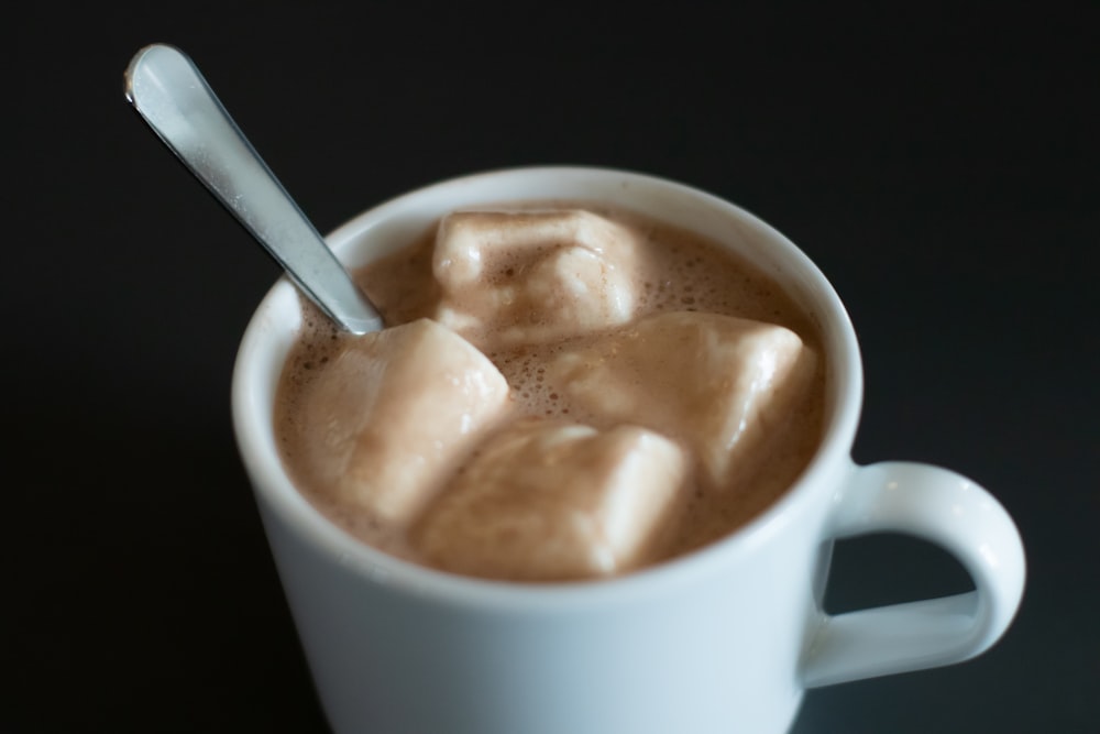 a cup of hot chocolate with marshmallows in it