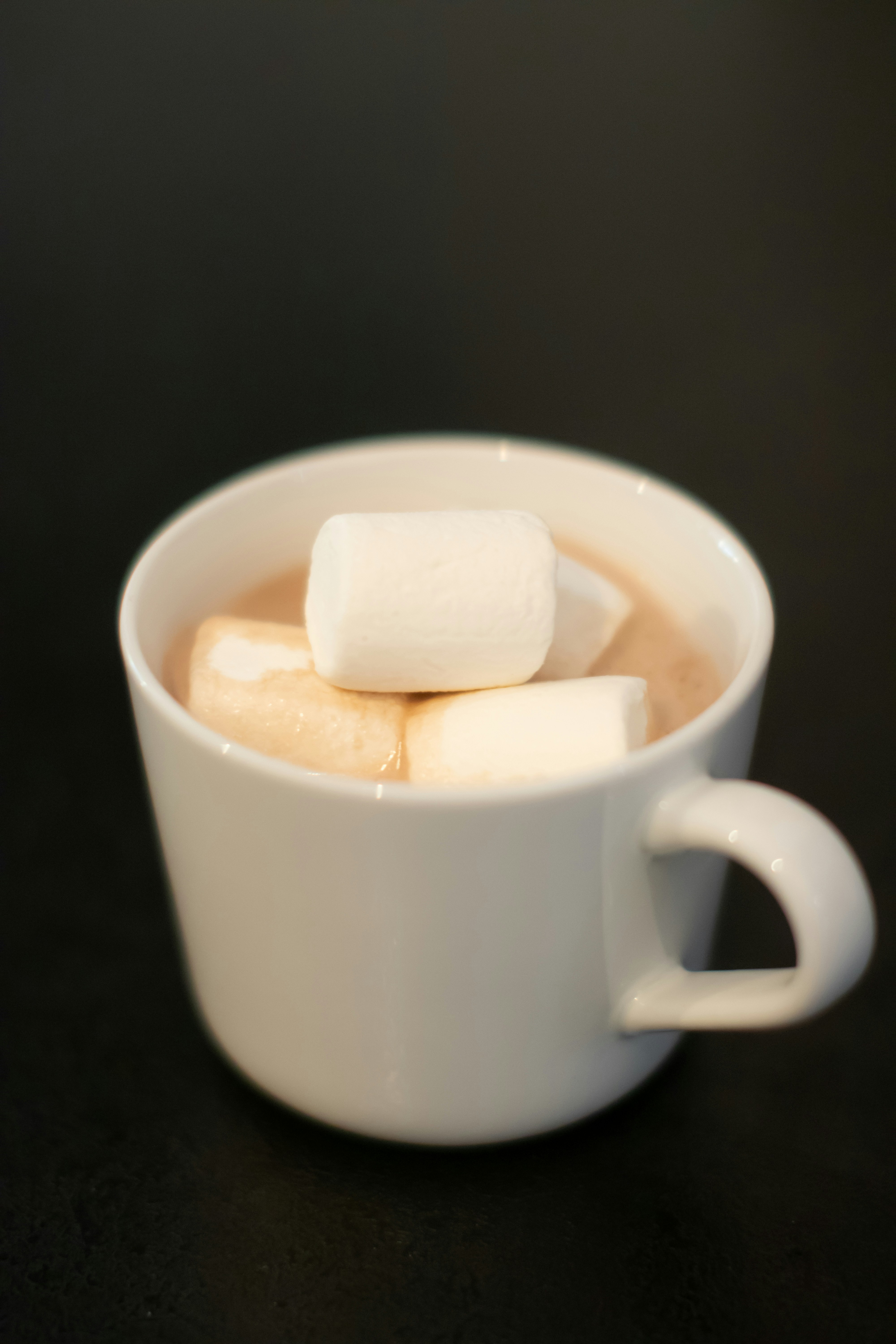 a cup of hot chocolate with marshmallows in it