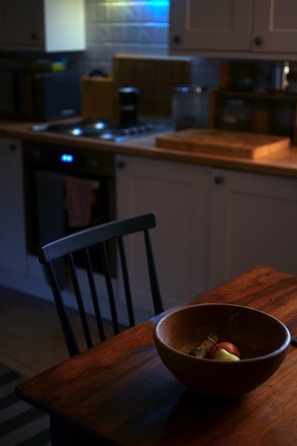 A cozy kitchen setting with fresh produce and cooking utensils ready for meal prep.