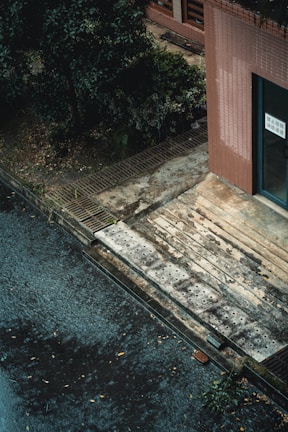 Before and after shots showcasing waterproofing of outdoor concrete stairs.