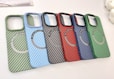 a group of four cell phones sitting on top of a table