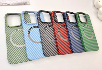 A collection of colorful phone cases with unique printed patterns.