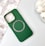 A green and black striped phone case with a cutout for the camera and a magnetic card holder indication. Two rabbit-shaped white objects are placed to the right, and a subtle floral design is in the background.