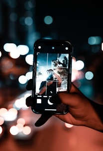 A user taking a photo with a smartphone.