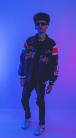 NBA star wearing a sleek jacket and sunglasses at a public event.