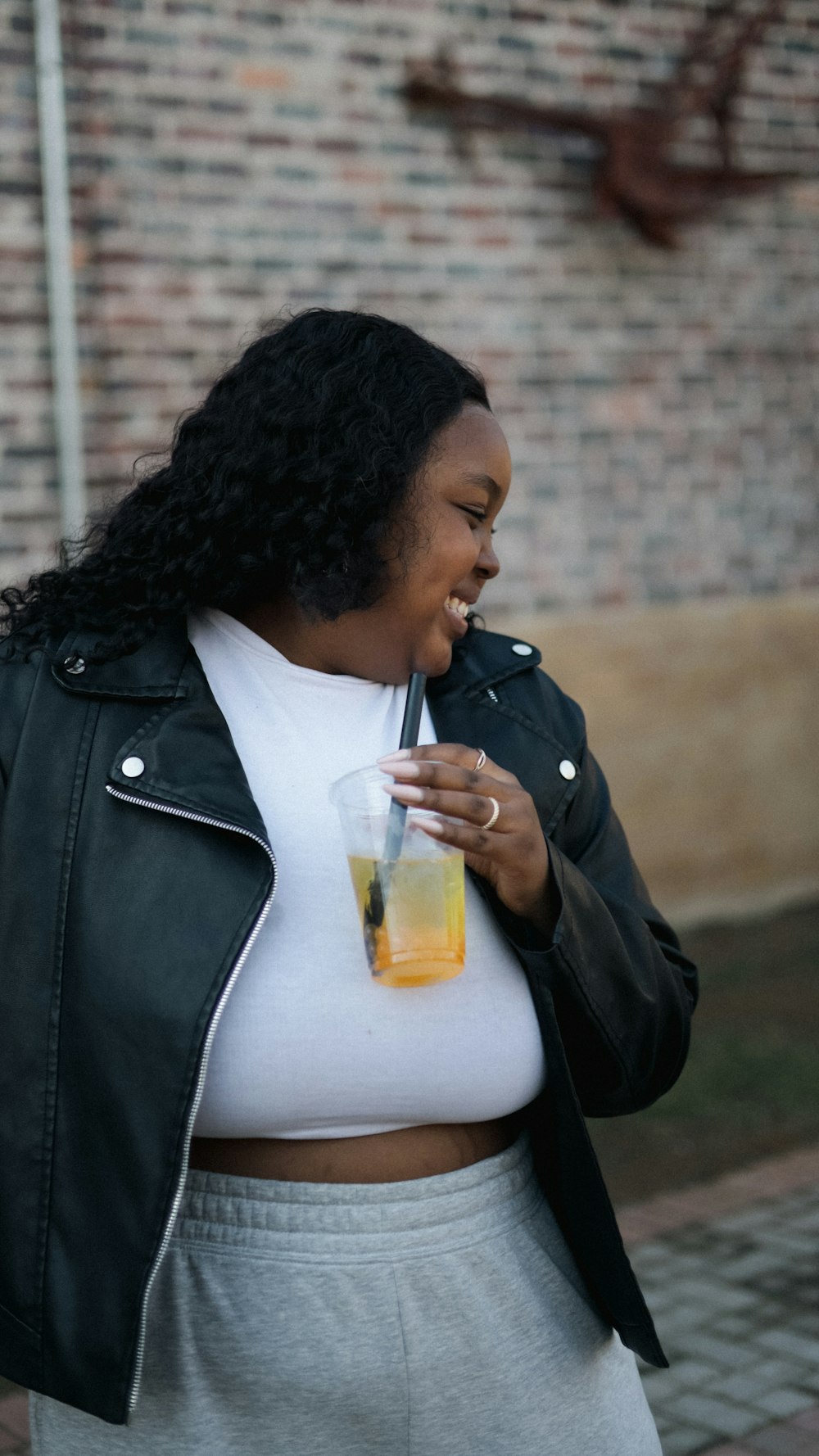 a woman in a white shirt and a black jacket