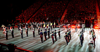 A vibrant drill team mid-performance, their synchronized movements capturing energy and focus under bright stadium lights.