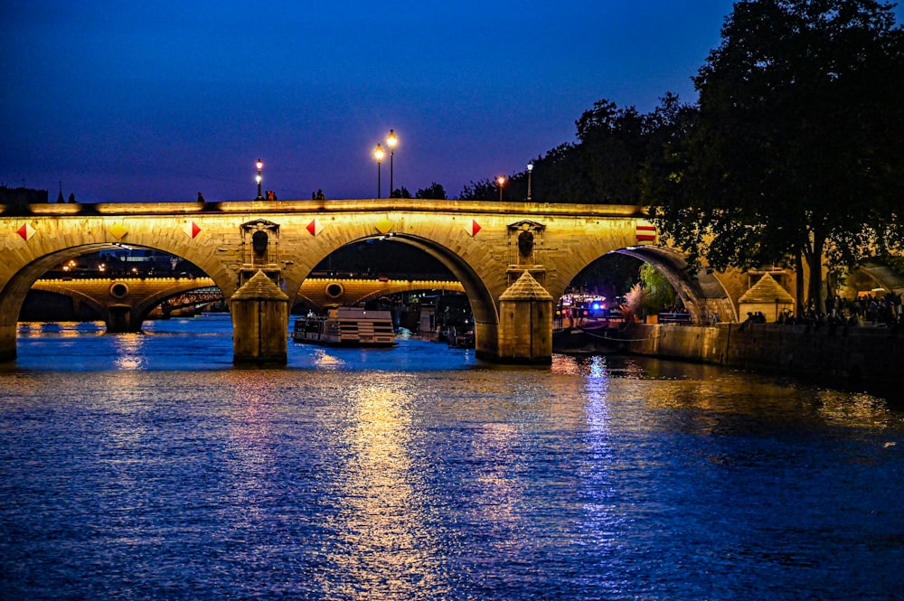 a bridge over a body of water at night