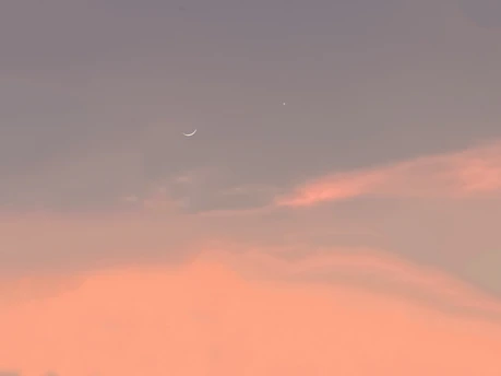 A soft pastel illustration of a glowing star gently floating above a dreamy cloud, surrounded by tiny sparkling hearts and twinkling stars.