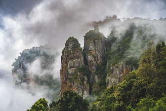 a mountain covered in fog and clouds