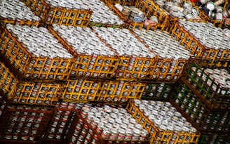 Warehouse with neatly stacked cartons of beer ready for shipment.