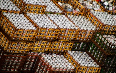 Stainless steel beer kegs neatly arranged in a warehouse