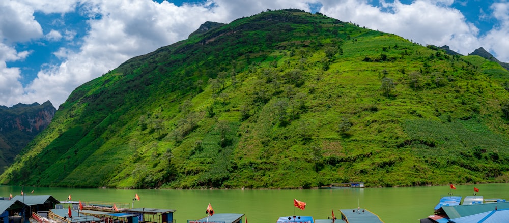 a group of boats floating on top of a lake