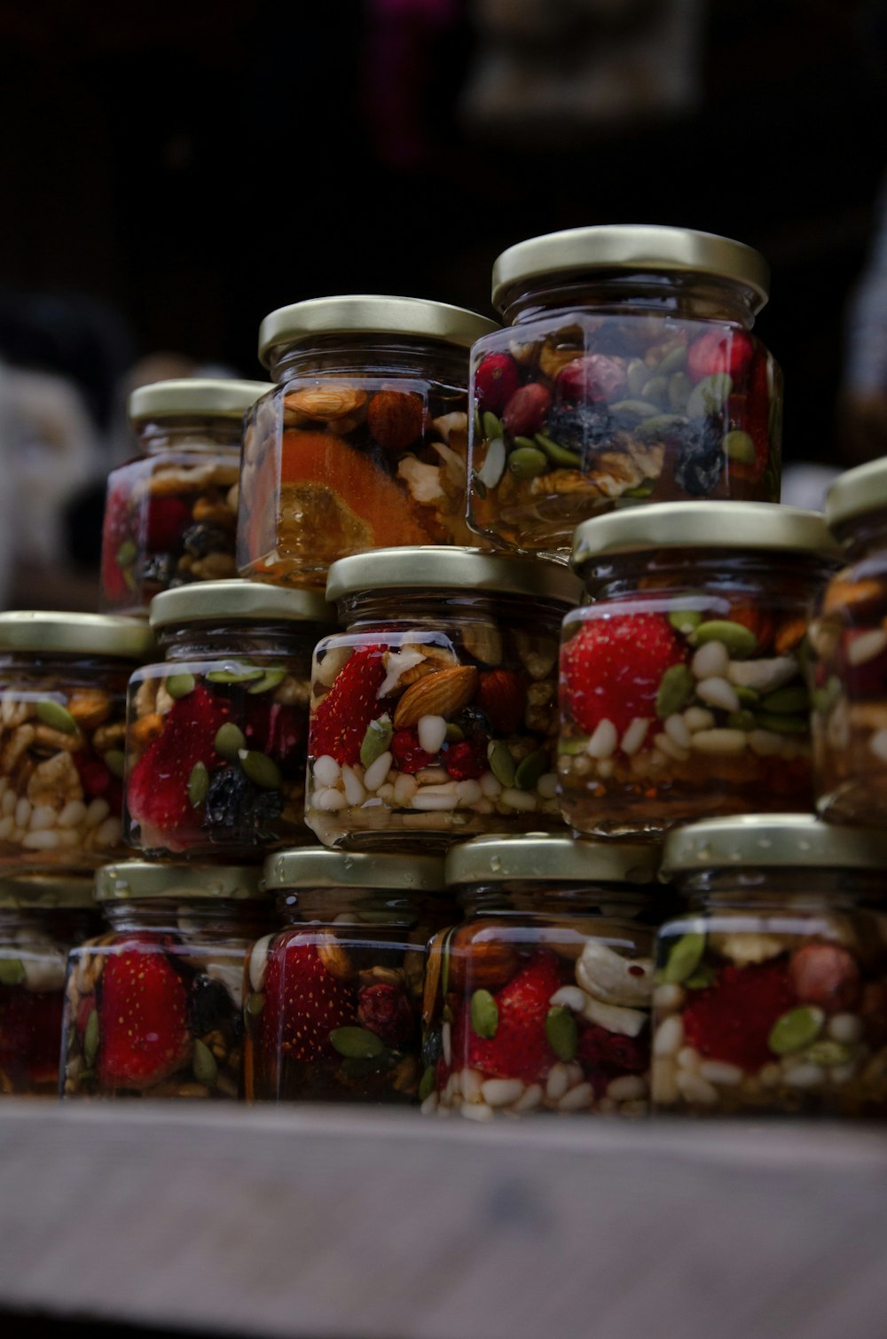 a bunch of jars filled with different types of food