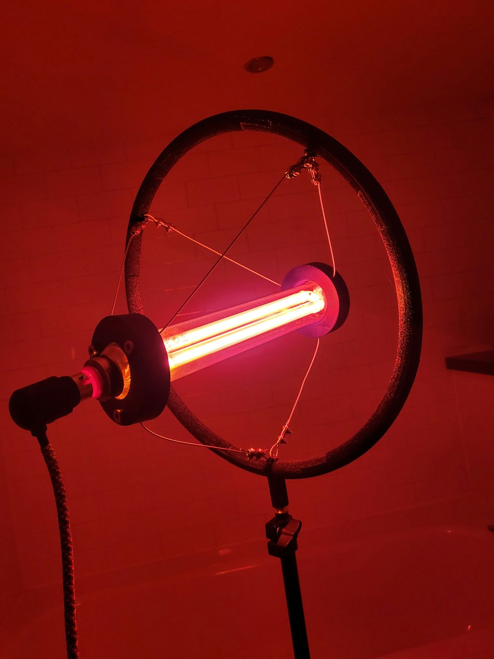 a red light is shining on a spinning wheel