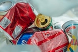 a pile of cans and cans of soda