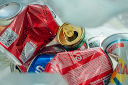 Stacks of used beverage cans ready for recycling and shipment.