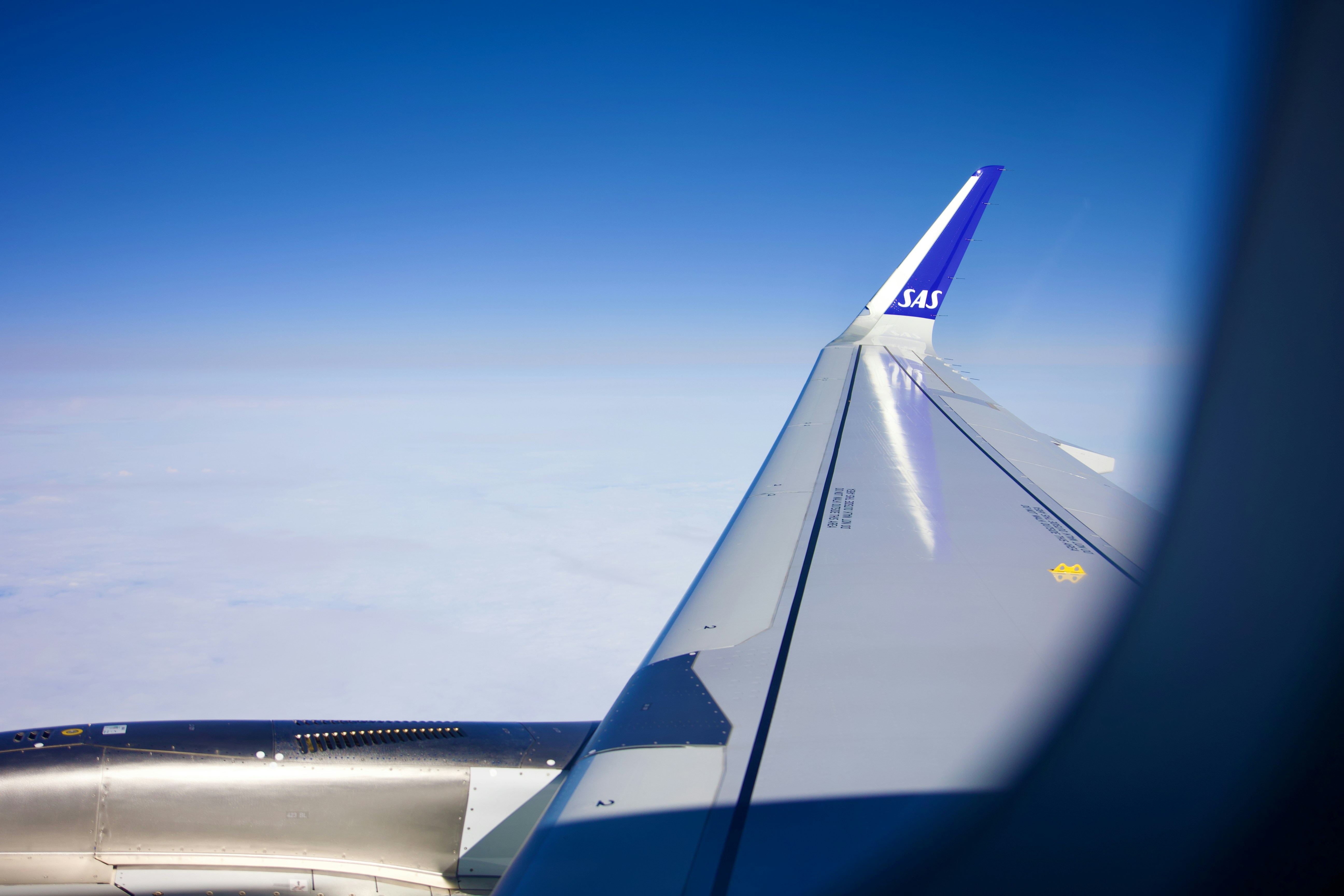 a view of the wing of an airplane in the sky, Wing of an Airbus A320neo.