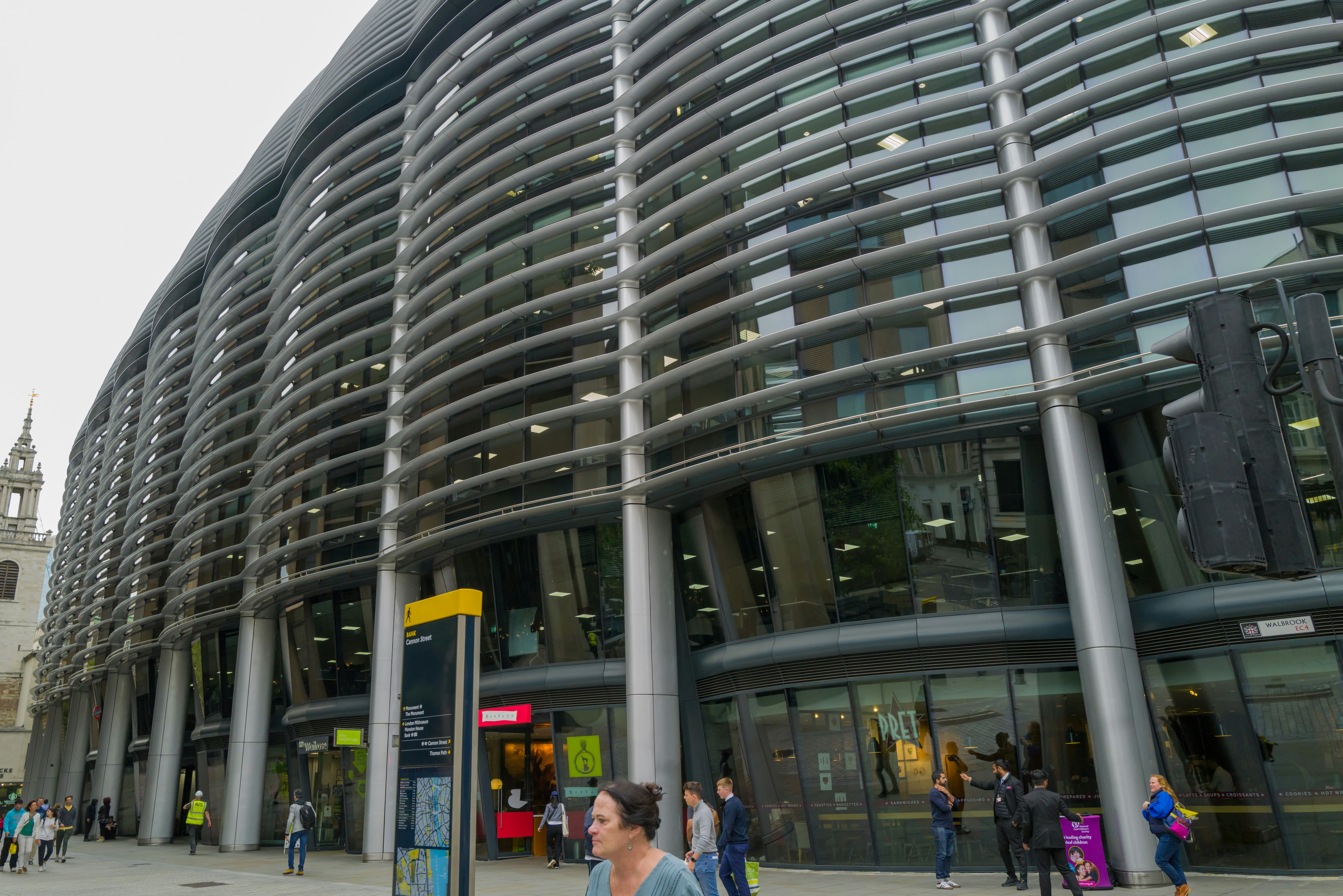 Modern London office building with glass facade representing Heikin Ashi Crypto Hub headquarters