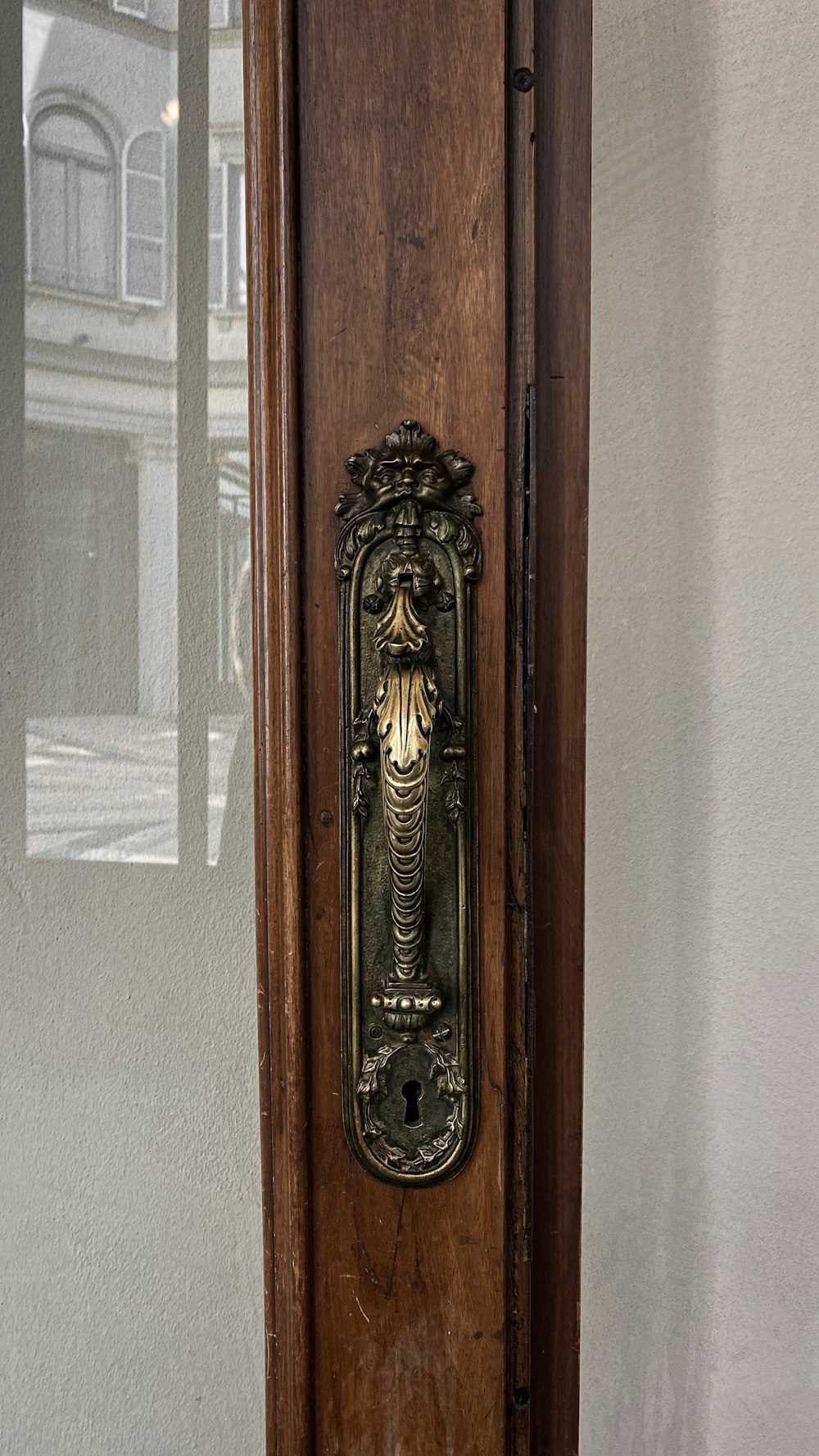 a wooden door with a metal handle on it
