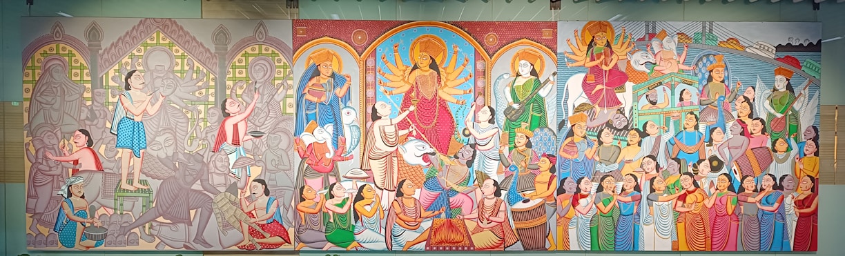 A vibrant mural depicting symbols from the Bible, Hinduism, and Islam blending together over the Nepalese landscape.