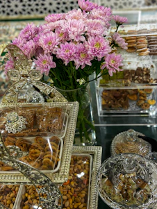 A beautifully arranged spread of premium dry fruits and elegant gift hampers set against a backdrop evoking Indian cultural warmth and family togetherness.